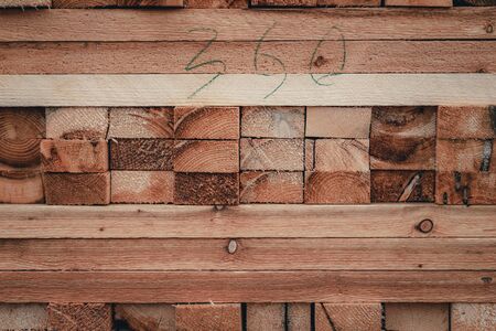 Wood and Sawmill. Large round logs harvested for construction. Production and sale of building materials. Stacked boards and logs. The texture of wood.の写真素材