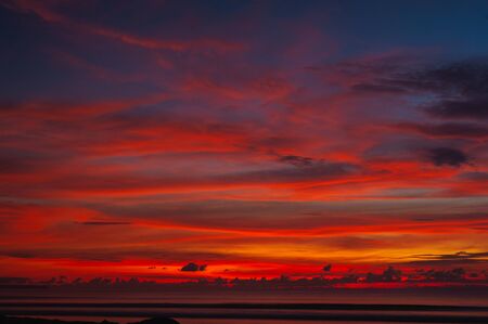 Stunning dramatic sunset over the ocean.の写真素材