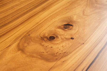 Style wooden countertop slab, saw cut wood treated with varnish close-up on black. Isolate.の写真素材