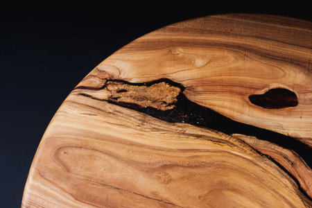 Style wooden countertop slab, saw cut wood treated with varnish close-up on black. Isolate.の写真素材