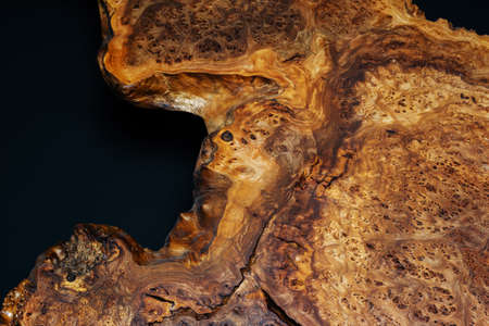 Style wooden countertop slab, saw cut wood treated with varnish close-up on black. Isolate.の写真素材