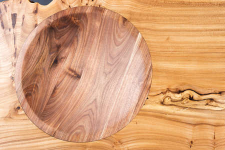 Style wooden countertop slab, saw cut wood treated with varnish close-up on black. Isolate.の写真素材