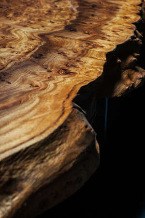 Extreme close-up, wood texture, wooden countertop slab, saw cut wood on black. Isolate.の写真素材