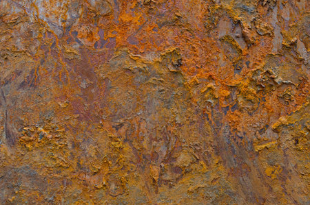 Texture of rusty metal of bright orange color