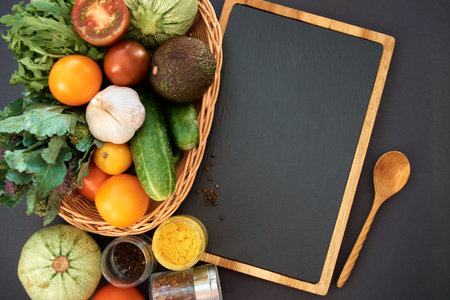 Vegetables dark background with copy space. Healthy meal. Menu, price background. Vegetables on...