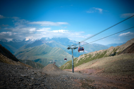 Mountain ranges on a sunny day in Georgia. Funicular in the mountains of georgia. mountain cable car in summerの写真素材