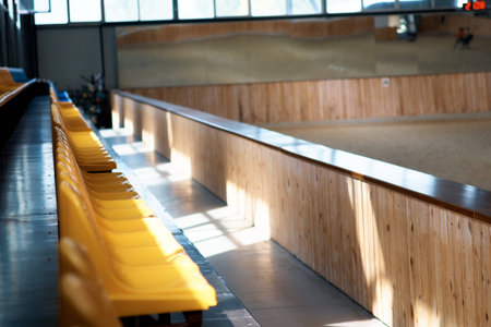 A grandstand at a hippodrome for horse racing. Rows of seats in a stadium