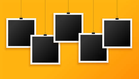 five hanging photo frames on yellow backgroundのイラスト素材
