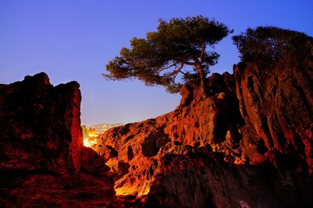 Night, rocks and town