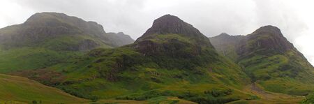 highlands valley of scotland with mountainsの写真素材