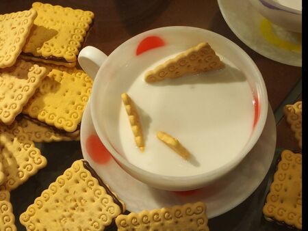 inviting, fresh breakfast with milk and golden cookies  の写真素材