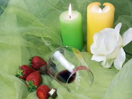 sensual, voluptuos seductive evening for lovers with red wine, chocolate and strawberries after dinnerの写真素材