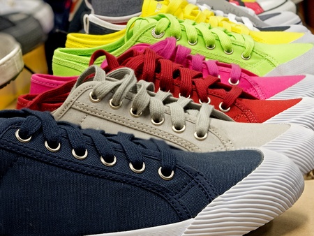 colored sports shoes made of rubber and canvasの写真素材
