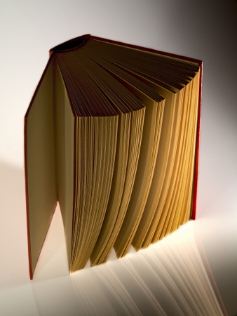 hardback  book opened vertically lights and shadowsの写真素材