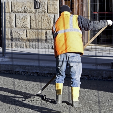 worker man with the shovel working in the sunの写真素材