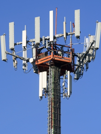 big telephone antennas pylon , blue skyの写真素材