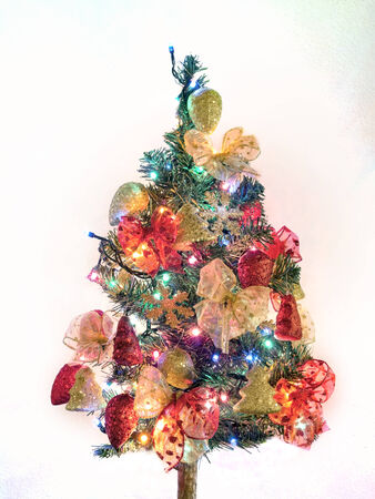 Christmas tree with decorations and lights onの写真素材