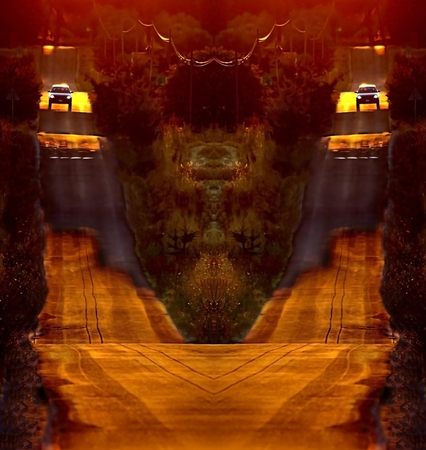 surreal car running on asphalt downhill at sunset duskの写真素材