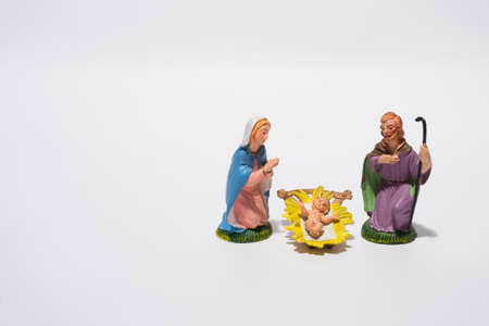 figurines of the nativity scene on white backgroundの写真素材