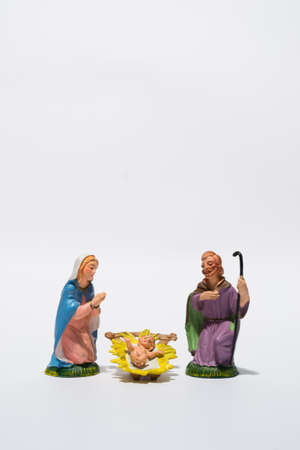 figurines of the nativity scene on white backgroundの写真素材