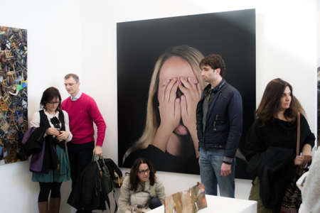Bologna,Italy-  people walk and look at works of art in an exhibitionのeditorial素材