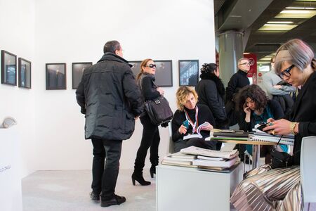 Bologna,Italy- people walk and look at works of art in an exhibitionのeditorial素材