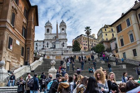 Rome,Italy-March 17,2013 people walking on the steps of spanish admiring the church Trinity of the mountains in romeのeditorial素材