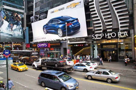 New York City, USA - August 2, 2013 time square in the daylight is full of advertising signs,billboard, traffic and people walking by shopping or sightseeing のeditorial素材
