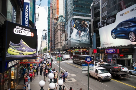 New York City, USA - August 2, 2013 time square in the daylight is full of advertising signs,billboard, traffic and people walking by shopping or sightseeing のeditorial素材