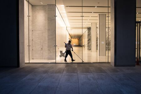 New York City, USA - August 3, 2013 person who washes the floor of a room at the end of a day in new yorkのeditorial素材