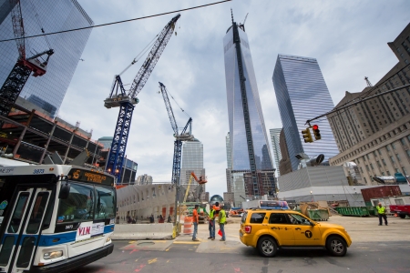New York City, USA - August 3, 2013 view of World Trade Center tower over Ground Zero Lower Manhattan as people pass through the intersection of Albany and Greenwich Streets のeditorial素材