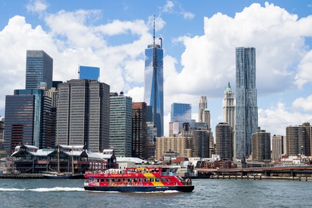 New York City, USA - August 4,2013 manhattan skyline view from brooklyn bridge park boats carry tourists on the hudson river to admire the skylineのeditorial素材