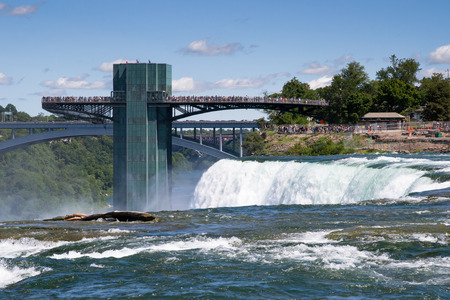 niagra Falls, USA - august 10, 2013 people on American vantage point on the Niagara Falls admire the show on a sunny dayのeditorial素材