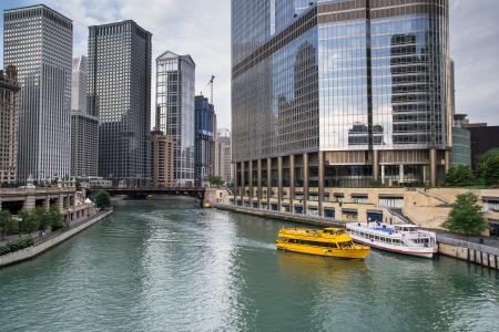 Chicago,USA-august 12,2013 Chicago skyline, looking west from Michigan Avenue bridge, view on Chicago River and water taxi in a daytimeのeditorial素材