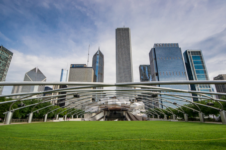 Chicago,USA-august 12,2013 Jay Pritzker Pavilion at the millenium park in Chigago in a sunny day with chicago skyline on backgroundのeditorial素材