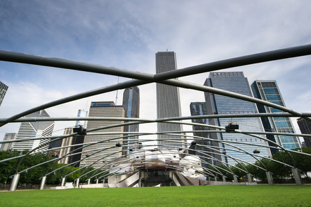 Chicago,USA-august 12,2013 Jay Pritzker Pavilion at the millenium park in Chigago in a sunny day with chicago skyline on backgroundのeditorial素材