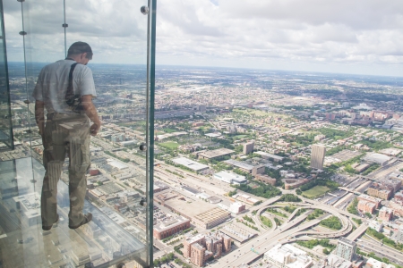 Chicago,USA-august 13,2013 the tallest building in the western hemisphere and the third tallest in the world  At 1,353 feet in the air, the Ledgeâs glass boxes extend out 4 3 feet from Skydeckの写真素材