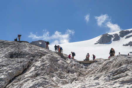 people walking on the Marmolada and admire the sceneryのeditorial素材