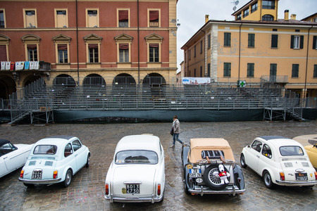 san giovanni in persiceto,bologna,italy-march 1,2014 meeting of classic cars in the square of city in a rainy dayのeditorial素材