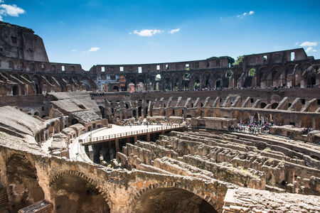 Rome,italy-April 17,2014 tourists admire the interior of the ancient roman coliseum in the sunny day in the center of Romeのeditorial素材