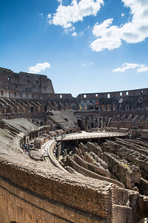 Rome,italy-April 17,2014 tourists admire the interior of the ancient roman coliseum in the sunny day in the center of Romeのeditorial素材