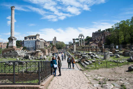 rome,italy-April 17,2014 tourists stroll admiring the majesty of the Roman Forum in a sunny day in Romeのeditorial素材