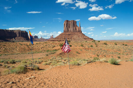 arizona,USA-August 6,2012 american and arizona flags inside the monument valley park during a sunny dayのeditorial素材