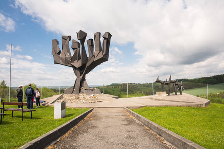 mauthausen, Austria - May 10,2014 people admire one the Jewish monument before entering the camp during a cloudy dayのeditorial素材
