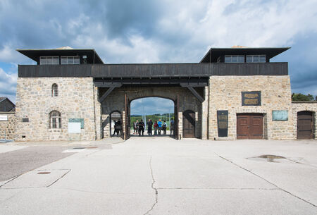 mauthausen, Austria - May 10,2014 people entering the concentration camp of Mauthausen from the main entrance during a cloudy dayのeditorial素材
