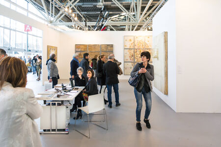 Bologna,Italy-January 24,2015:people walk and look at works of art in an exhibition while art experts answer all questions related to the artists on display.のeditorial素材