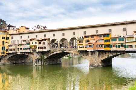 Florence,Italy-August 26,2014:view of ponte vecchio over the river Arno during a cloudy dayのeditorial素材