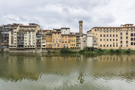 Florence,Italy-August 26,2014:view of th houses on the bank of the Arno near the Pontevecchio during a cloudy day.のeditorial素材