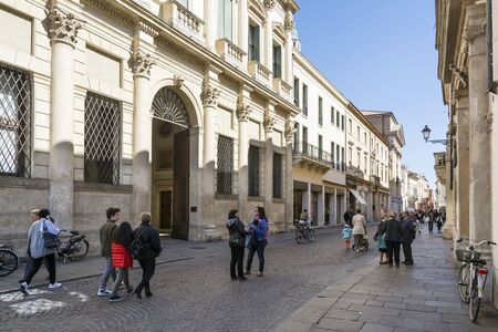 Vicenza, Italy-April 3.2015: People and tourist stroll in the famous Palladio street in the historic center of Vicenza.Here are ahead the palace Thiene Bonin During a sunny day.のeditorial素材