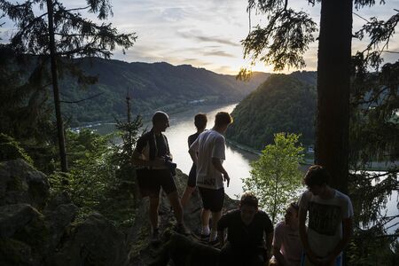 Schloegener SchlingeAustriaMay 82015: people looking the view on the famous geological site in Austria on Danube river during a sunrise.のeditorial素材